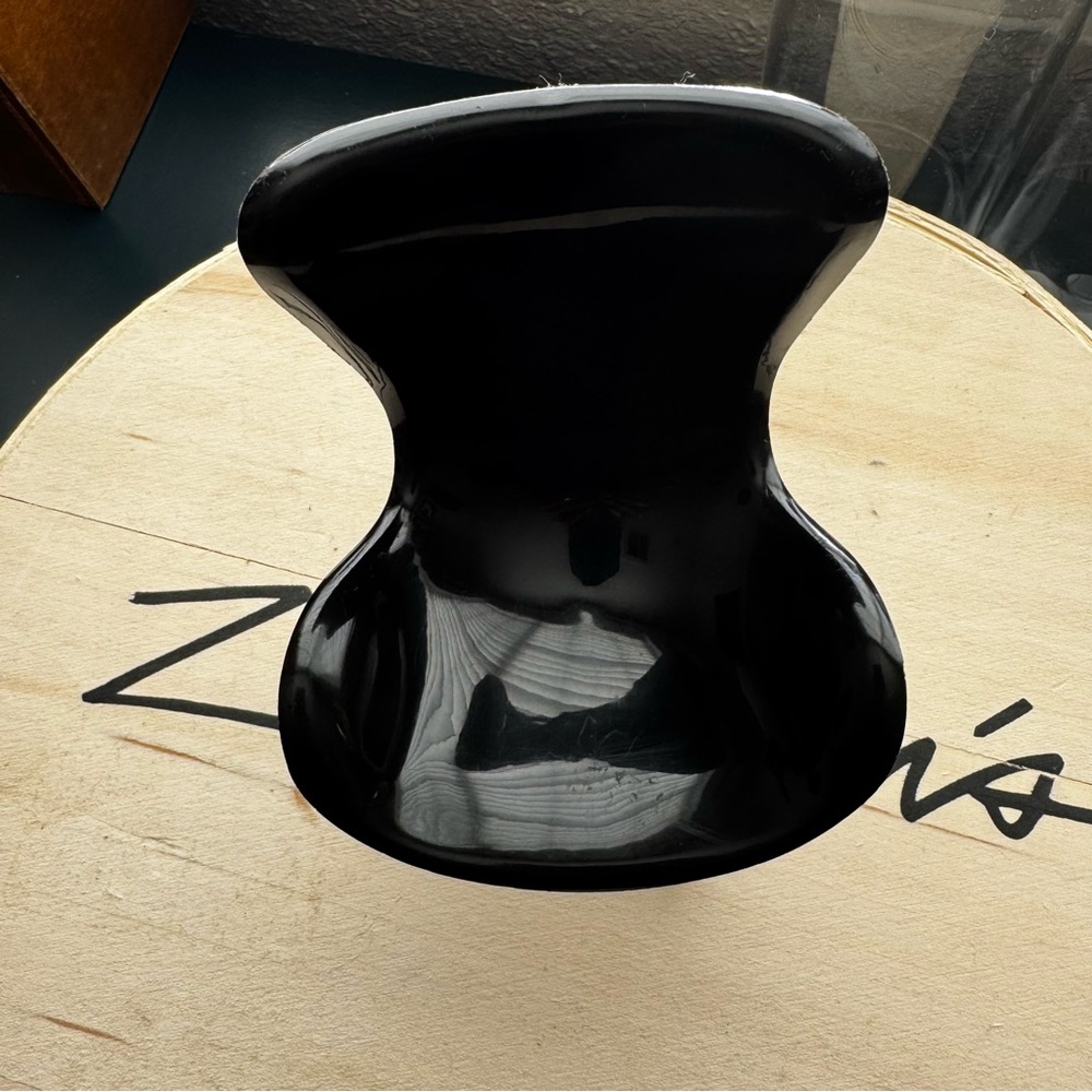 Miniature replica of the black Arne Jacobsen Egg Chair.